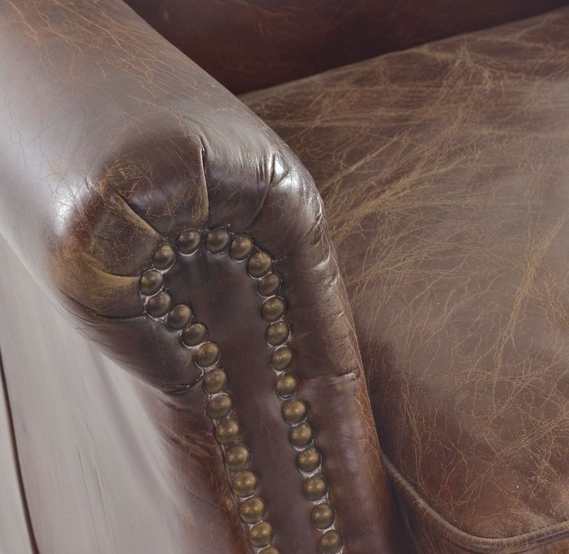 Product photograph of Ancient Mariner Vintage Leather Studded Front Armchair from Choice Furniture Superstore.